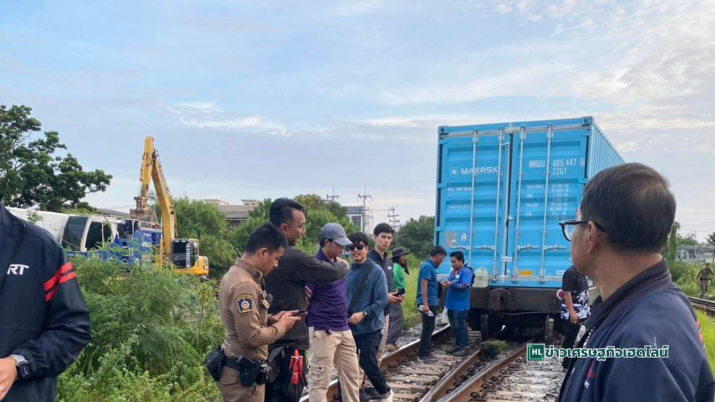 train staffs inspect  derailment 